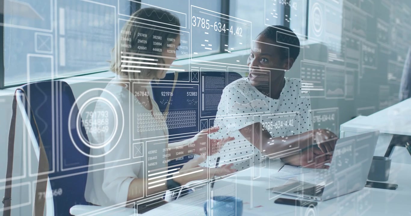 Business colleagues typing query in laptop analyzing sales figures, causing translucent data panels