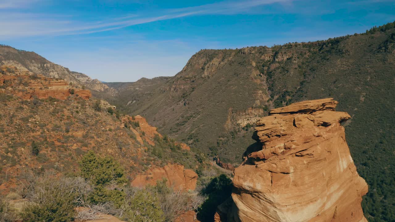 Spectacular aerial shot flying through opening along canyon wall. Shot in 4k in Arizona