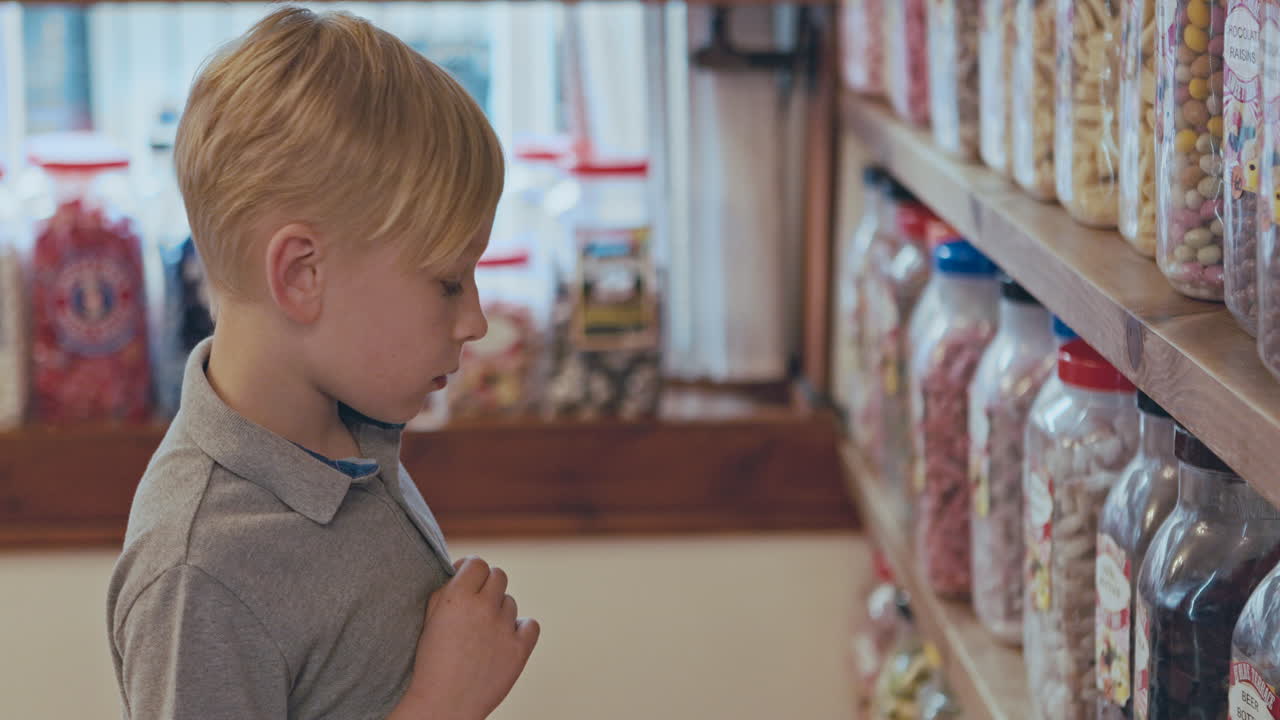 A boy in a candy store