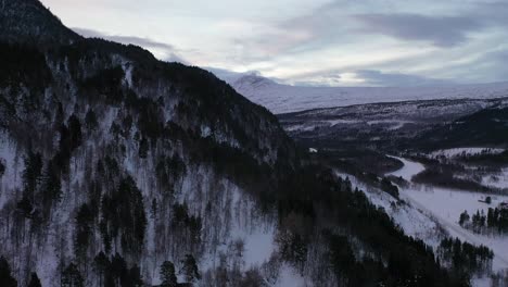 immerse yourself in stunning aerial views showcasing snowy arctic mountains and magical winter landscapes in northern norway's arctic circle, captured in breathtaking 4k resolution.