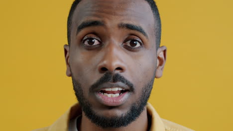 close-up portrait of a man with surprised expression