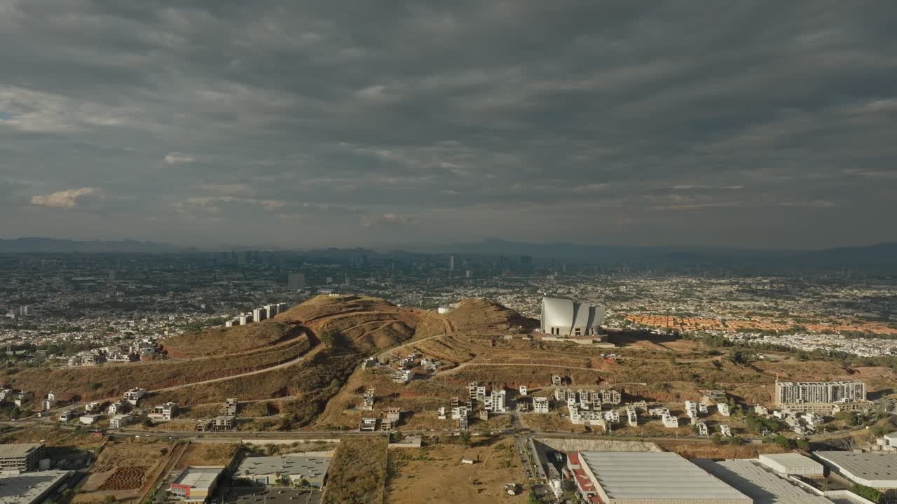 DRONE SHOT OF GUADALAJRA CITY ON A MIX CLOUDY AND SUNNY DAY