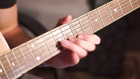 guitarist playing solo on acoustic guitar