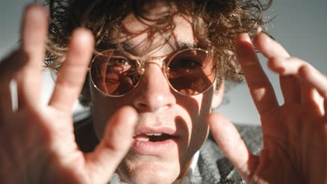 stylish man reaching out in slow motion montage