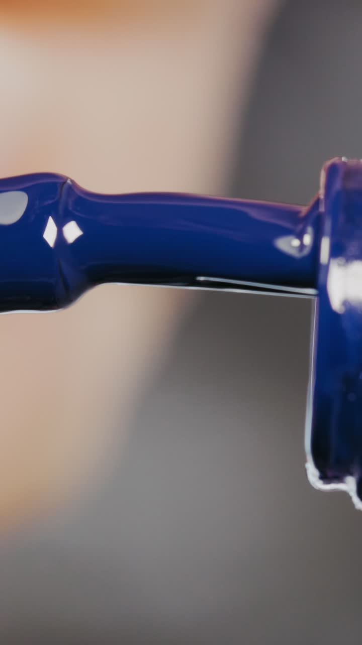 Close-up of a bottle of blue nail polish