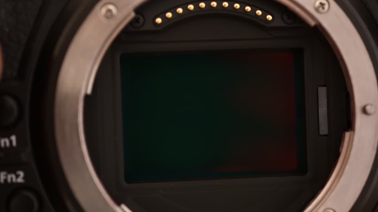 Close up view of a digital camera shutter opening