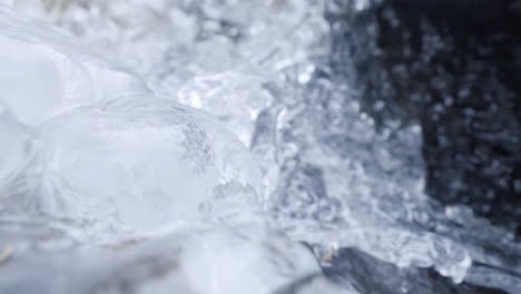 Wide-shot-of-camera-running-down-with-a-frozen-creek