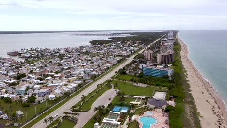 hotel resorts for tourists on vacation on hutchinson island on florida beach coastline, aerial