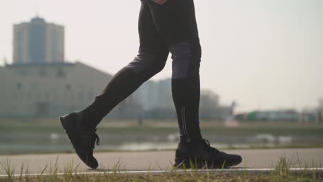 Close-up-of-person-walking-in-sports-outfit