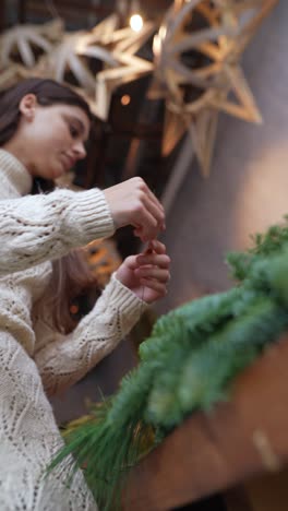 woman making a christmas wreath