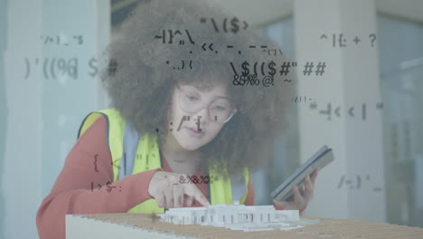 animation of data processing over biracial female engineer in hi vis vest with 3d building model