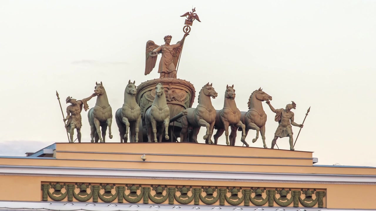 Sculptural group named Chariot of Fame lit by sunset sunlight on the roof of the Headquarters in Saint-Petersburg, Russia - detailed view timelapse hyperlapse