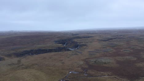 Canyon-of-Selá-river-with-three-waterfalls-in-reserve-area-of-North-Iceland-in-Autumn---Aerial-forward-approaching-flight