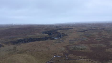 canyon of selá river with three waterfalls in reserve area of north iceland in autumn - aerial forward approaching flight