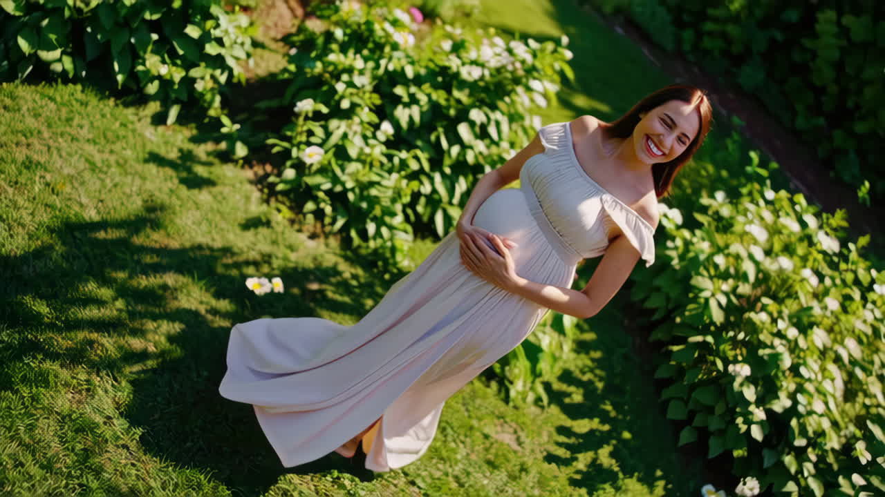 Pregnant woman in a garden on a sunny day