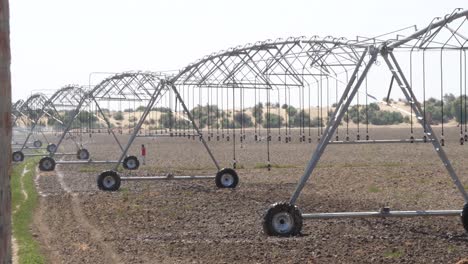 center pivot irrigation sprinkler system on farmland in punjab