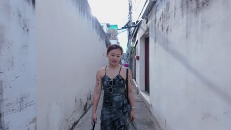 woman walking in a thai alley