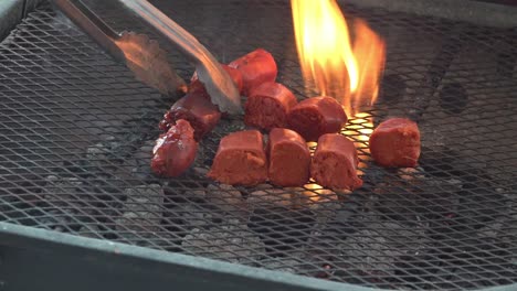 sausages and french chorizo on a grill