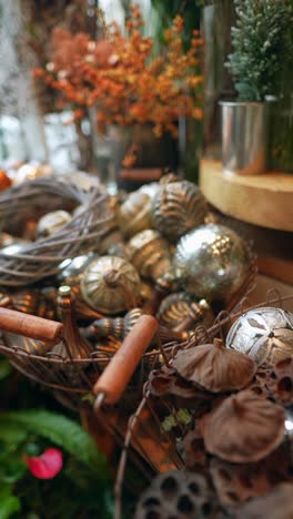 christmas ornaments and dried flowers display