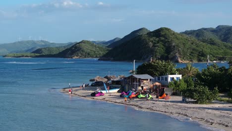 tropical beach with kiteboarding activities