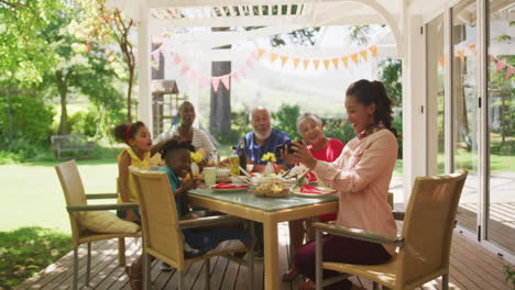 multi-generation african american family spending time in garden together