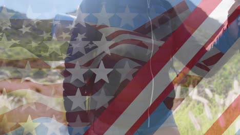 animación de la bandera de los estados unidos de américa sobre una mujer caminando por las montañas