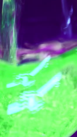 abstract vibrant green and purple liquid experiment