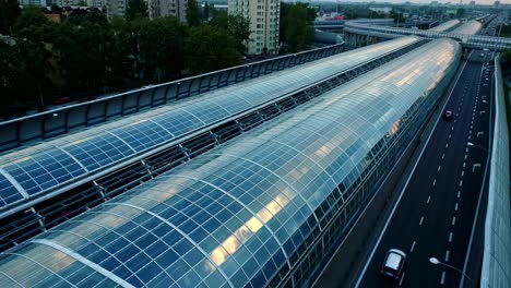 drone view on a modern glass tunnel construction over the highway in warsaw