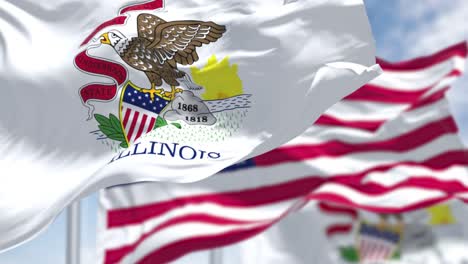 seamless loop in slow motion with two illinois state flags waving along with the national flag of the united states of america.