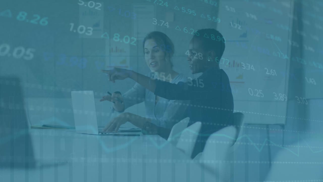 Animation of financial data over diverse female lcoworkers in office