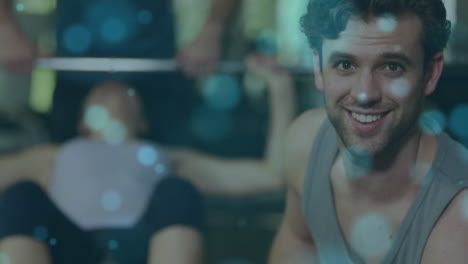 animación de luz brillante sobre un hombre en forma haciendo ejercicio en el gimnasio