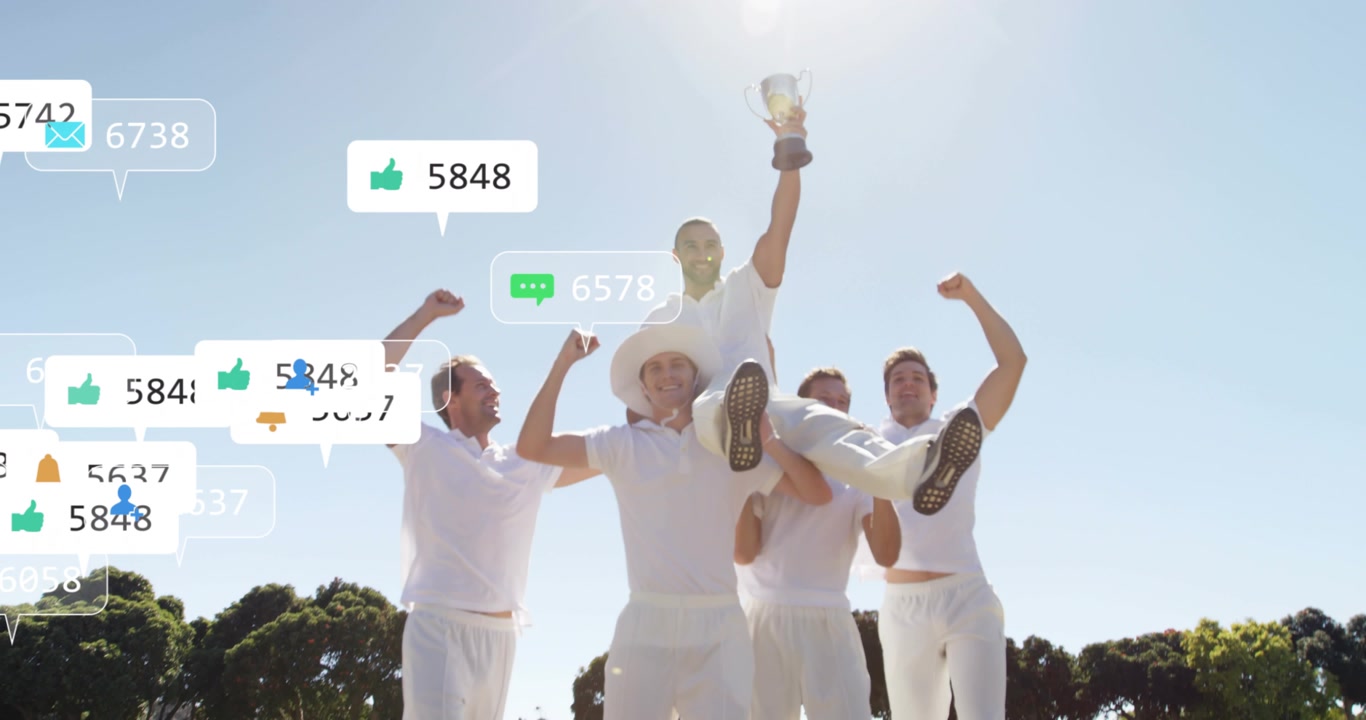 Five cricket players lifting teammate with trophy after match win, notifications flooding frame