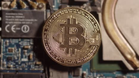 Slow-zoom-on-bitcoin-lying-on-the-computer-board