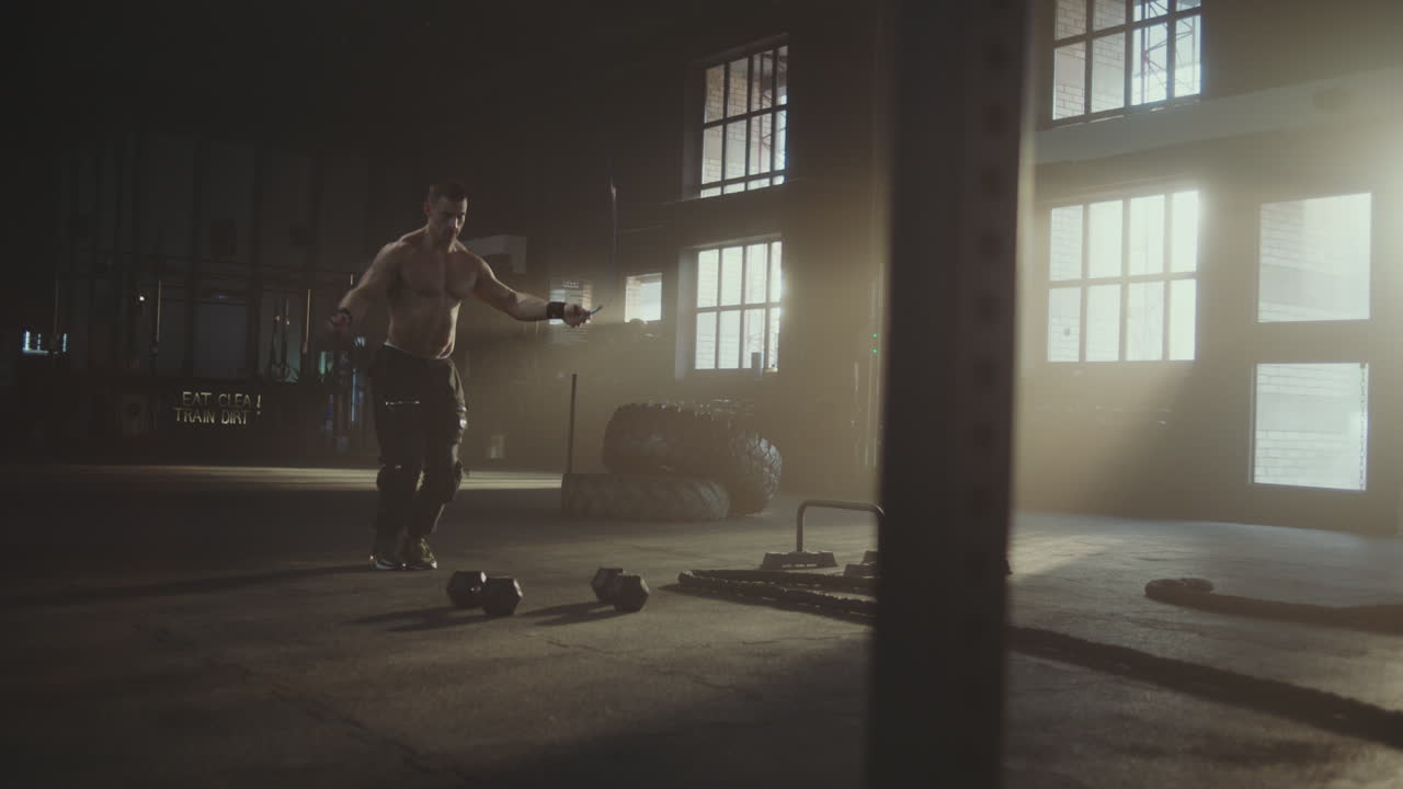 Man exercising with kettlebells in a gym