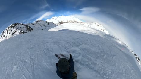 Aerial-shot-of-man-skiing-off-piste-down-extreme,-challenging-icy-mountain