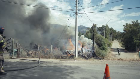 firefighters in action on a farm in flames in chile