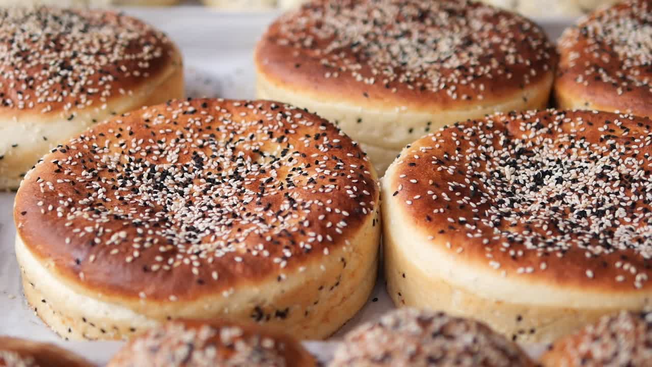 Freshly Baked Golden Brown Buns with Sesame Seeds