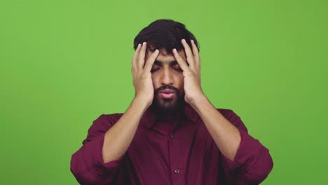 Attractive-man-finds-out-bad-news-and-puts-his-arms-on-forehead,-isolated-on-green-screen