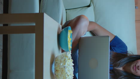 vertical video: lady having video calling on laptop computer