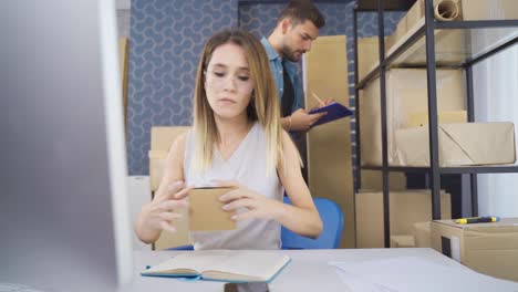 Couple-online-entrepreneurs-working-in-small-online-store-office.