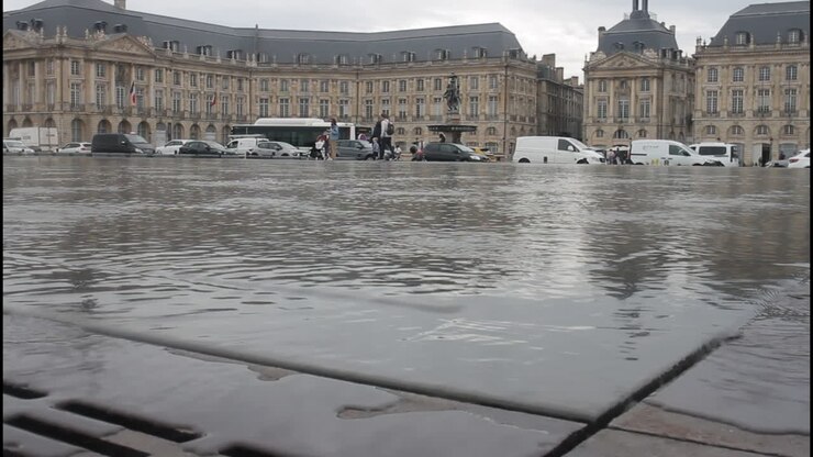 Water mirror reflecting buildings in Bordeaux, France