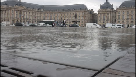water mirror reflecting buildings in bordeaux, france