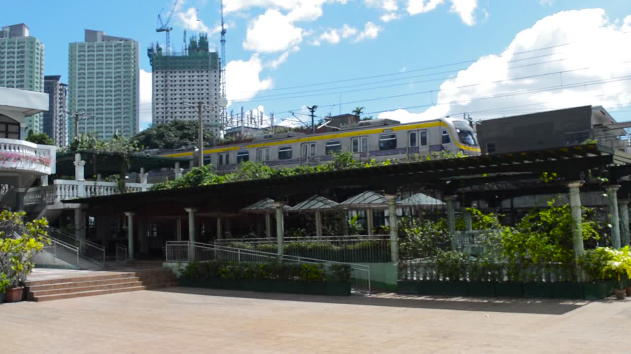 MRT passing by in a sunny and cloudy day.