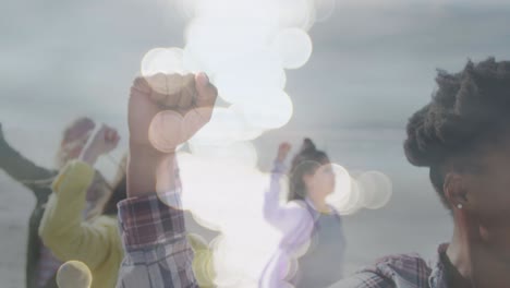 animación de diversas mujeres levantando las manos sobre puntos de luz