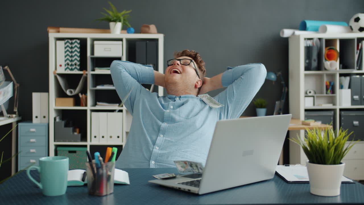 Man Celebrating at His Desk