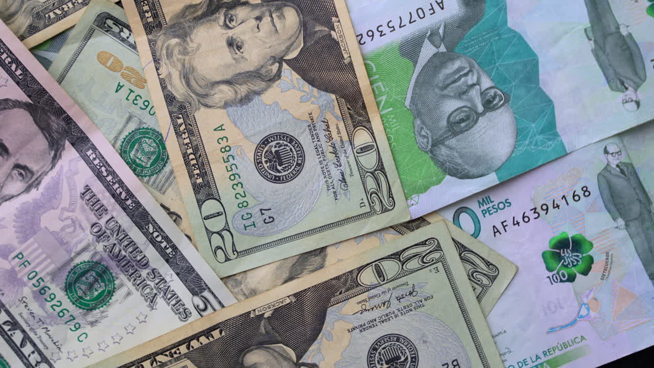 Detailed view of Colombian pesos and US dollars, highlighting currency differences. Crisp, colorful banknotes laid flat against a neutral background, perfect for financial and exchange themes