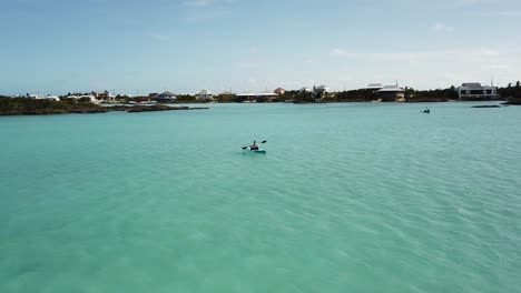 kayaker in the ocean off coast of providenciales in the turks and caicos archipelago