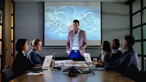 Businessman-giving-presentation-in-conference-room-4k