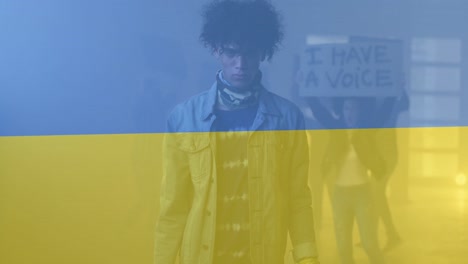 animation of flag of ukraine over african american male protester