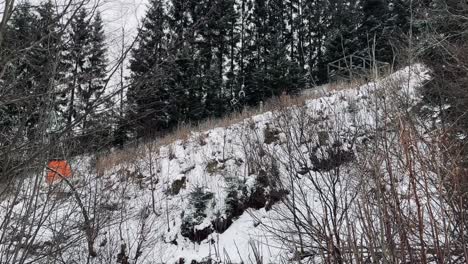 ski-lift-on-the-mountain-empty-without-people-travels-up-the-slope-through-the-forest